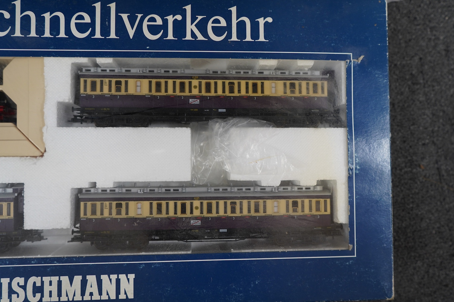 Three boxed Fleischmann HO gauge railway train sets; a passenger set with a 4-6-4T Loco and three clerestory coaches (4887), and two goods train sets, both comprising of a locomotive and an assortment of freight wagons (